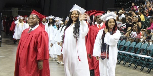 Seniors waving at graduation