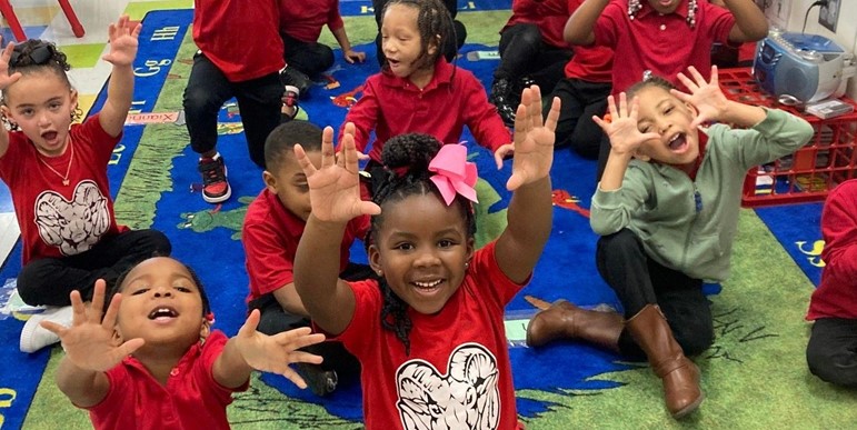 Students waving